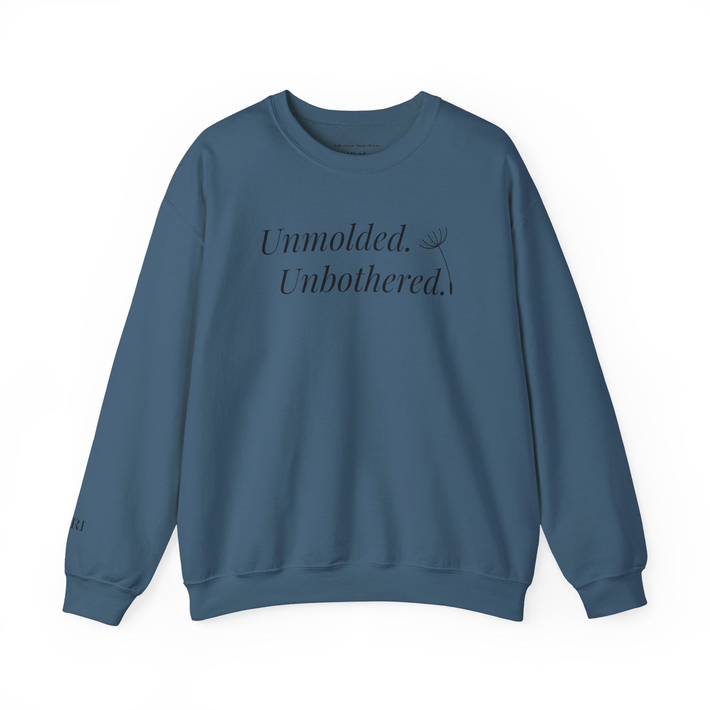 Blue sweatshirt with text 'Unmolded. Unbothered.' on a white background