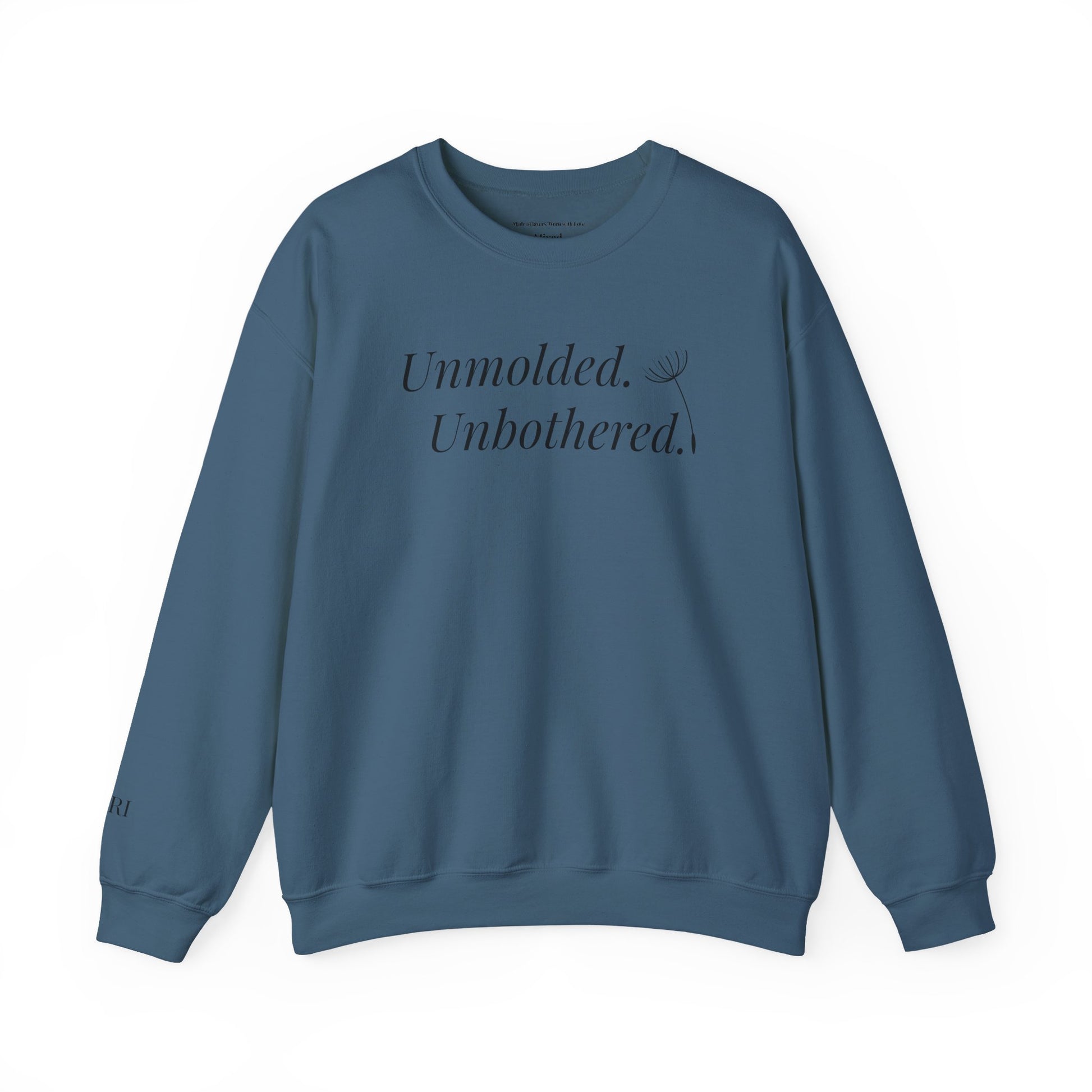 Blue sweatshirt with text 'Unmolded. Unbothered.' on a white background