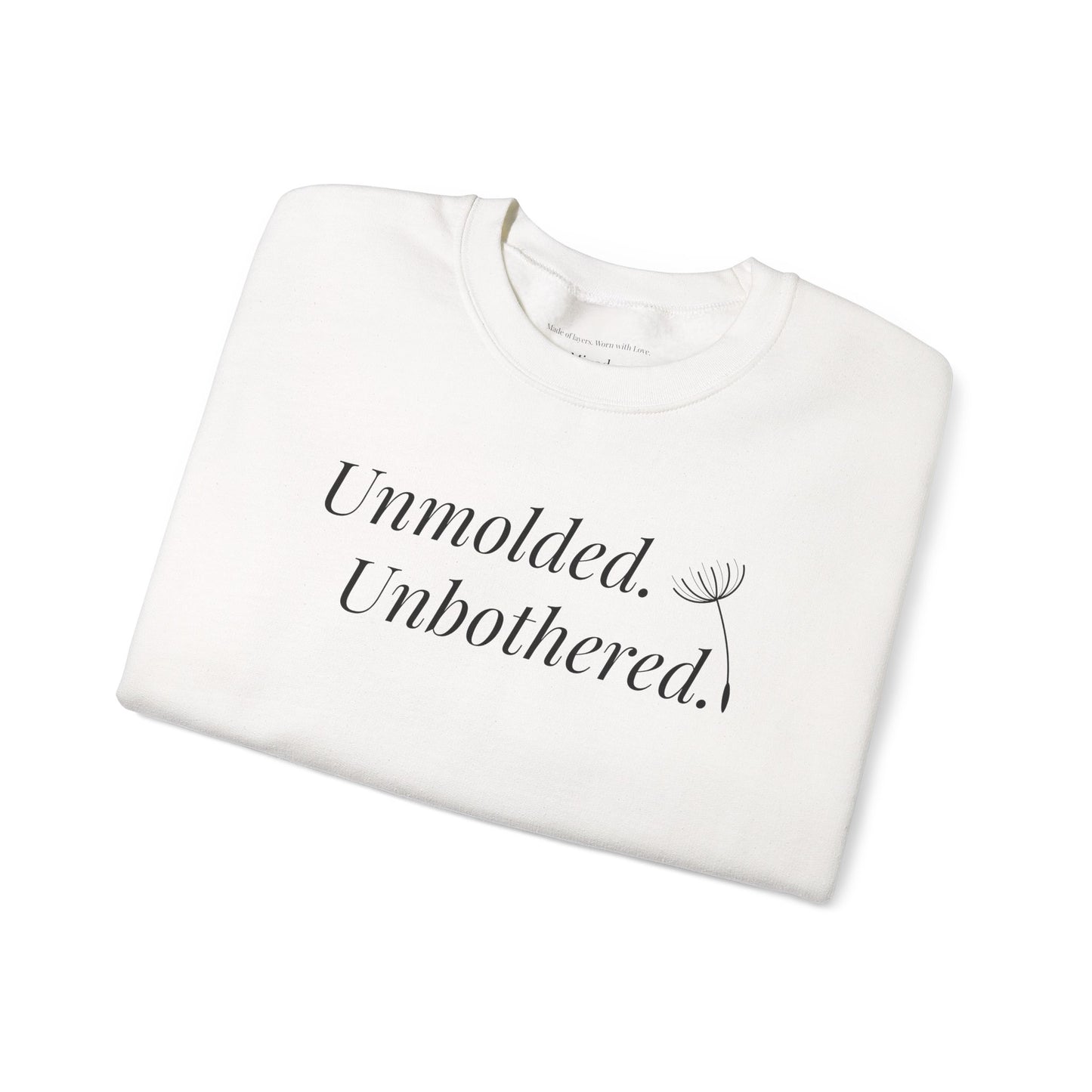 White Unmolded. Unbothered. sweatshirt with bold front text, folded flat.