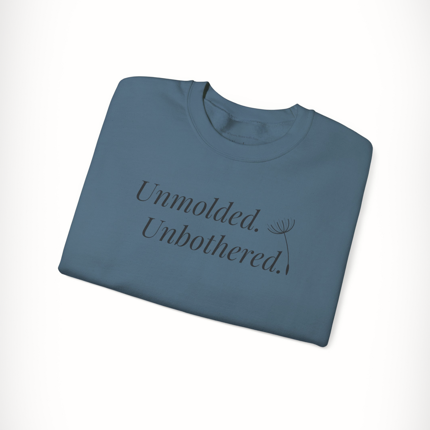 Blue Unmolded. Unbothered. sweatshirt with bold front text, folded flat.