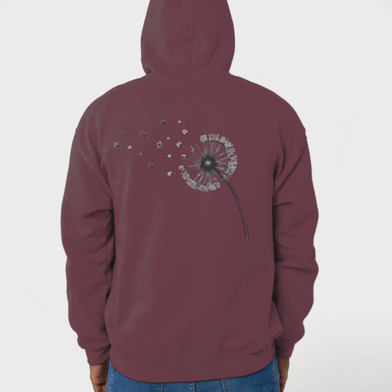 Back view video of man wearing maroon drift different hoodie. He takes the hood down and looks from side to side.