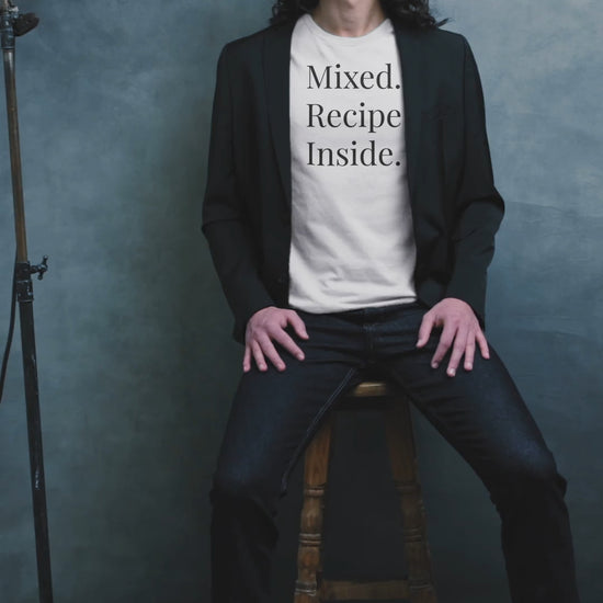 Short video of a man wearing white Signature Tee, dark jeans and black jacket.